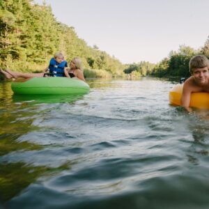 kids floating in river