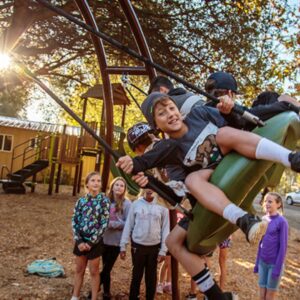 kids playing on swingset