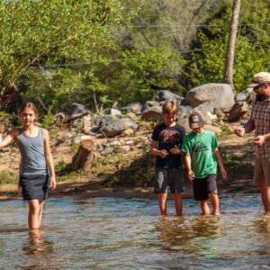 family fishing in the river