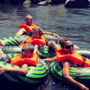 family tubing in the river
