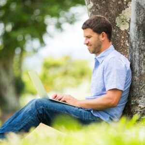person working on laptop outside