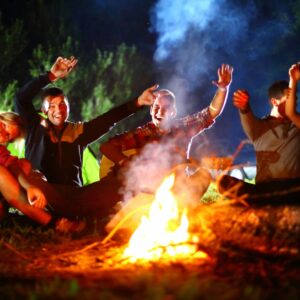Kids having fun around a campfire