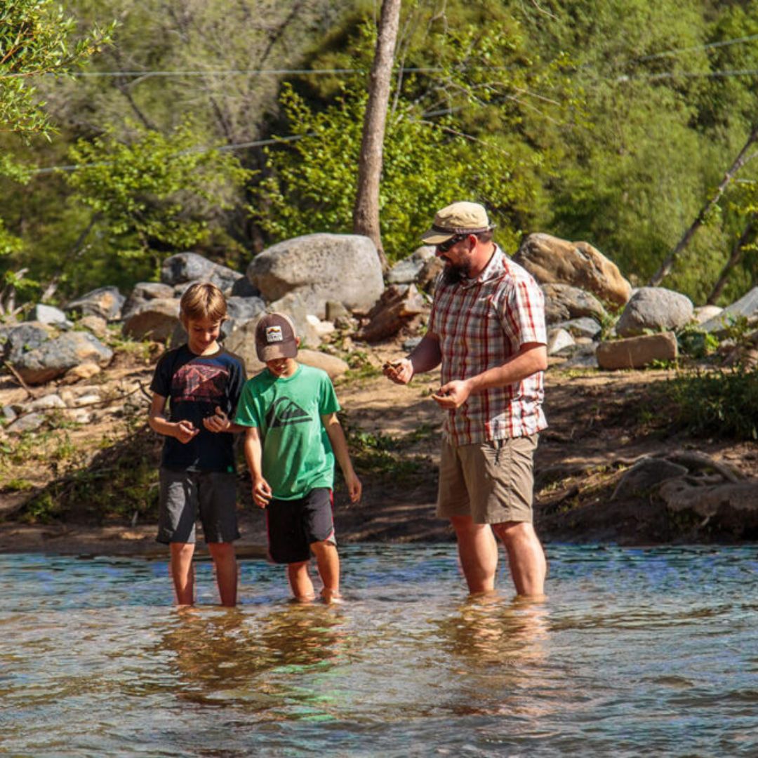 a family exploring a river