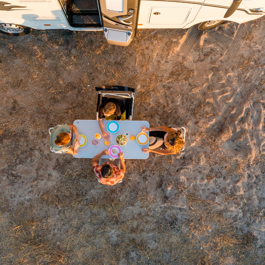 people eating outside of rv