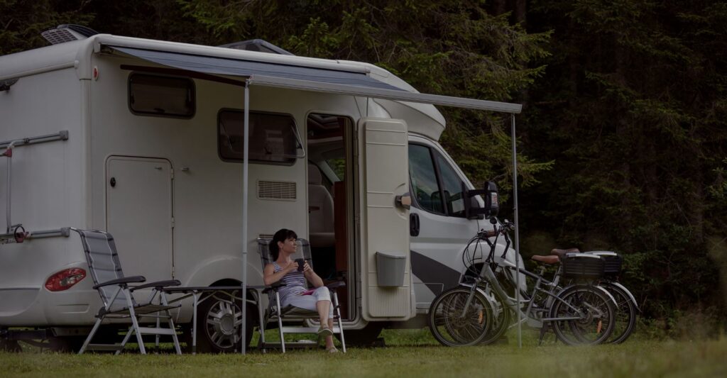woman sitting outside of RV