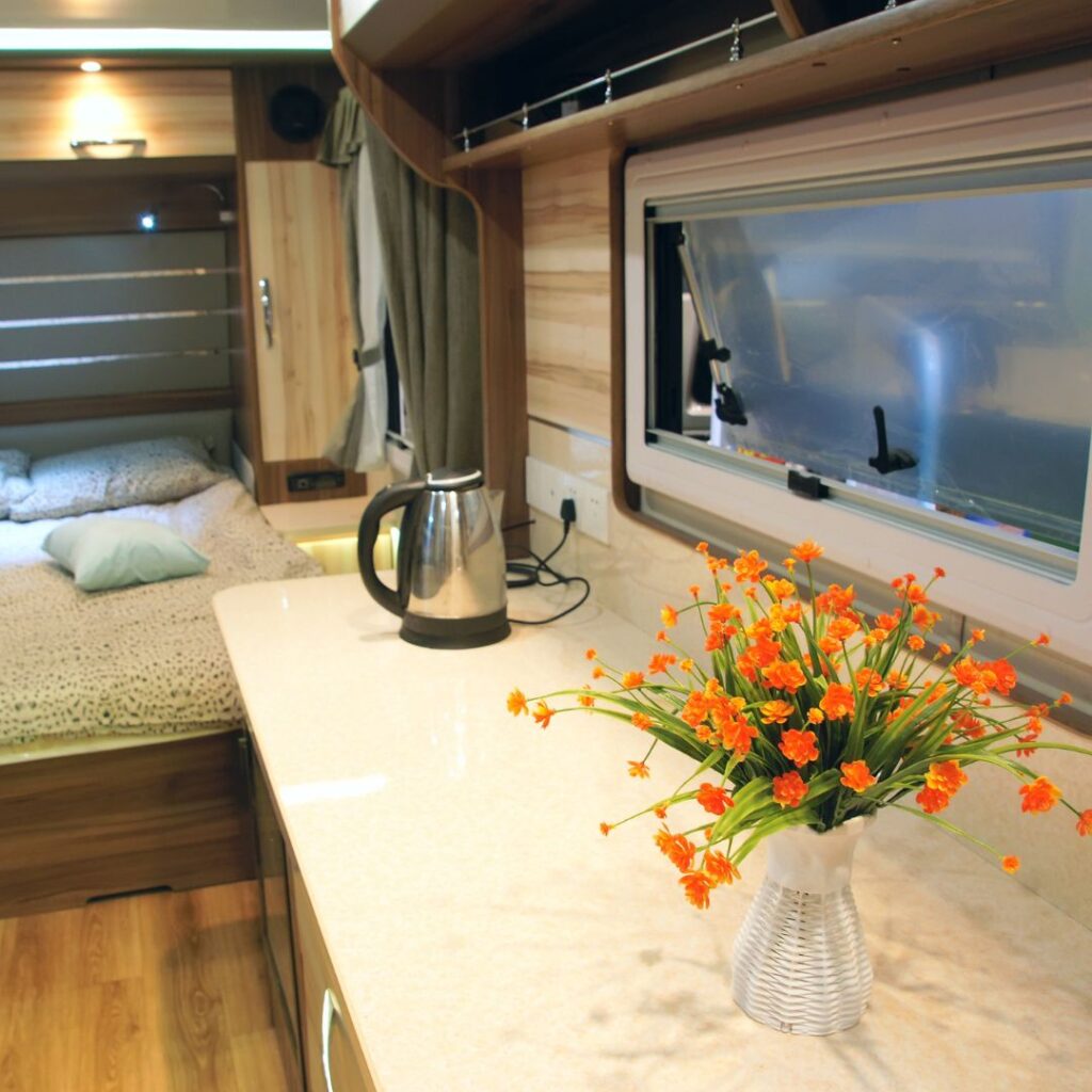 RV counter with coffee pot and pot of plants