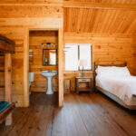 Cabin accomodations at Coloma Resorts- Minors Cabin image 9 Interior view-bathroom + bedroom