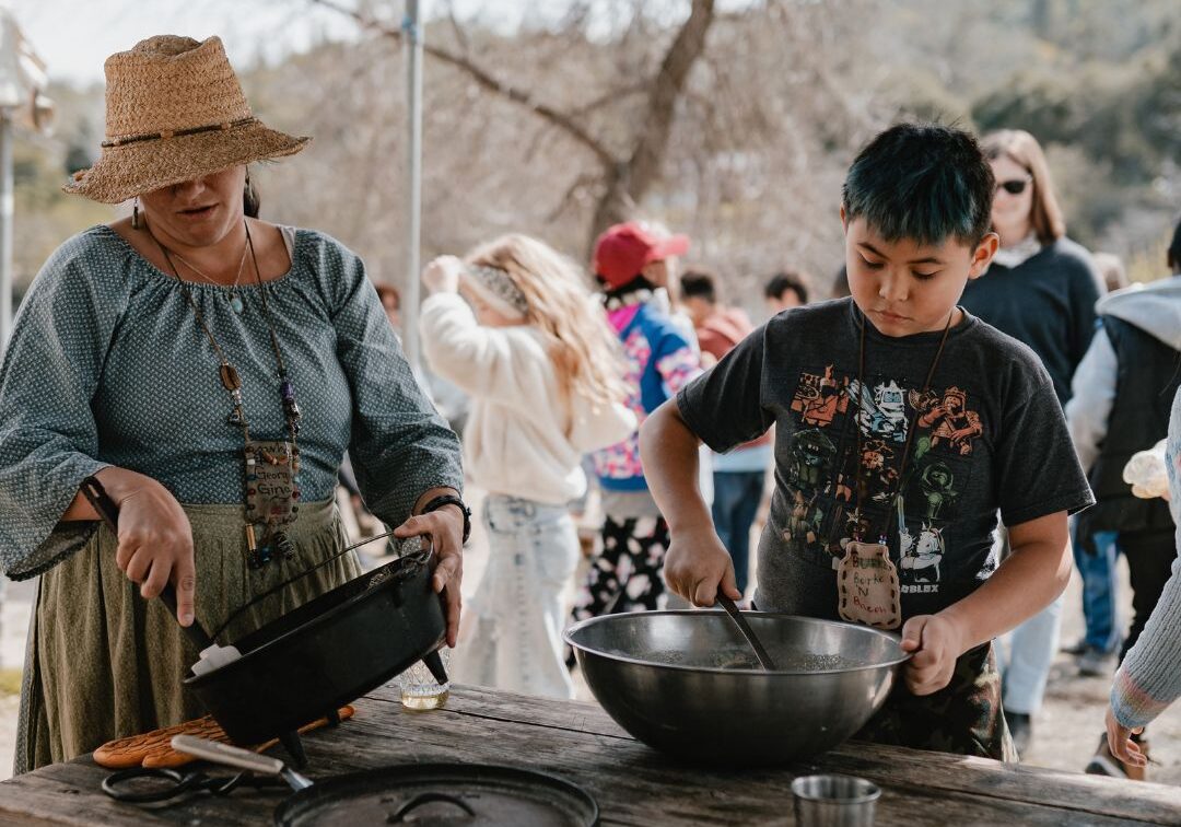 kids helping naturalist make cornbread