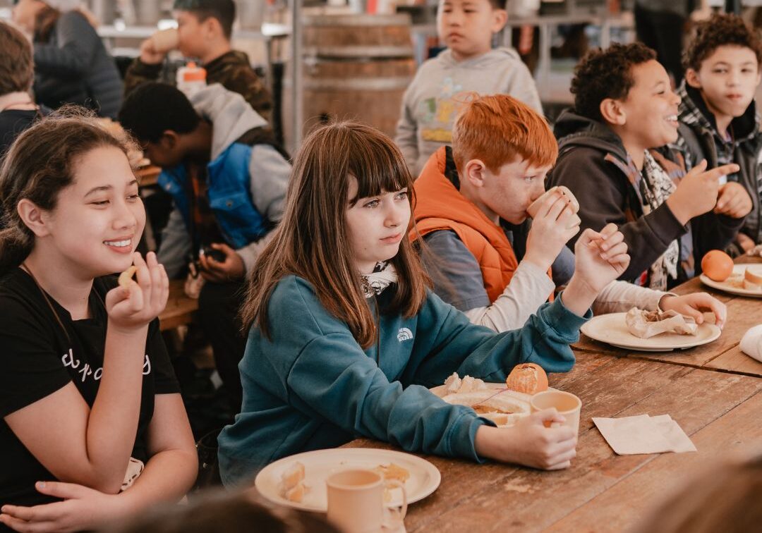 kids eating lunch together at tables